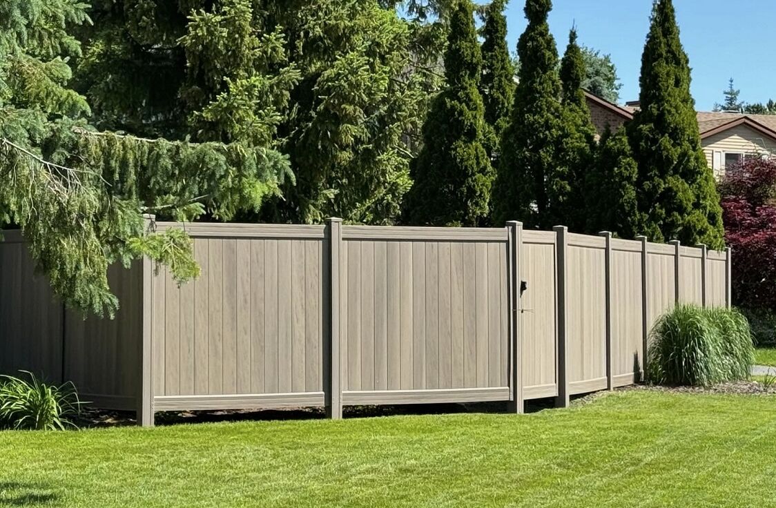 Two-tone vinyl PVC privacy fence in Pike Road, AL residential property